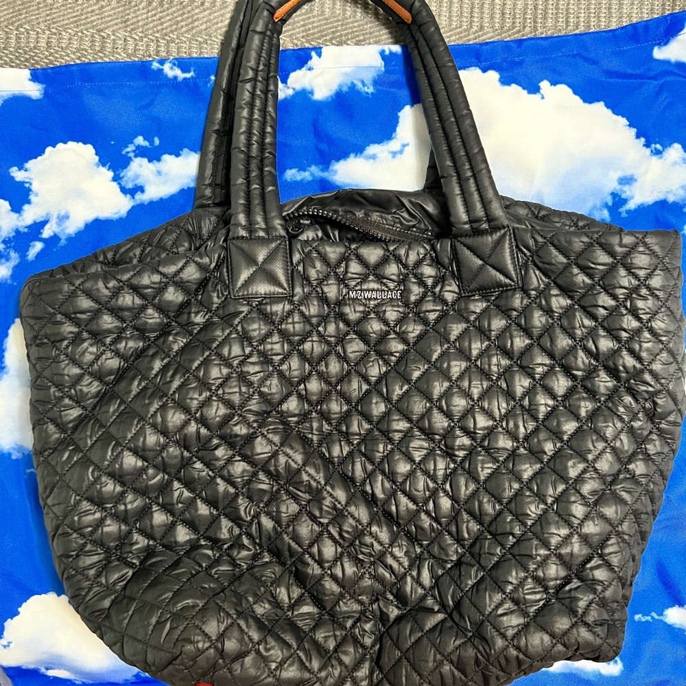 Large black MZ Wallace tote. Includes three interior pouches and dust bag.